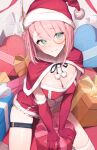  1girl box breasts cape charlotte_(genshin_impact) christmas cleavage dress fur-trimmed_headwear fur_trim genshin_impact gift gift_box gloves green_eyes hat highres looking_at_viewer monocle pink_hair red_headwear santa_dress santa_hat skindentation thigh_strap tooyon 