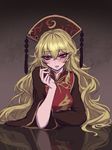  blonde_hair blush chinese_clothes crescent dark_background eyebrows eyebrows_visible_through_hair hair_between_eyes hat highres junko_(touhou) long_hair looking_at_viewer miata_(miata8674) parted_lips red_eyes reflection solo tassel touhou upper_body very_long_hair wide_sleeves 
