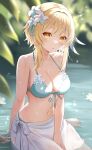 1girl bare_shoulders bikini blonde_hair blush breasts cleavage feather_hair_ornament feathers flower genshin_impact hair_flower hair_ornament highres large_breasts looking_at_viewer lumine_(genshin_impact) medium_hair nasii navel parted_lips pond sarong sidelocks solo swimsuit thighs water wet white_bikini yellow_eyes 