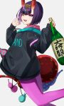  1girl black_sweater bottle breasts eyeliner fate/grand_order fate_(series) gourd headpiece highres hood hooded_sweater horns izanaware_game long_sleeves looking_at_viewer makeup one_eye_closed oni open_mouth pants pink_pants purple_eyes purple_hair sake_bottle short_hair shuten_douji_(fate) shuten_douji_(under_the_same_sky)_(fate) skin-covered_horns small_breasts smile solo sweater yoga_pants 