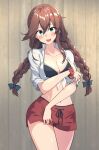  1girl bikini bikini_under_clothes black_bikini braid breasts brown_hair cleavage collared_shirt commentary_request cowboy_shot dress_shirt green_eyes highres kantai_collection long_hair medium_breasts navel noshiro_(kancolle) noshiro_(swimsuit)_(kancolle) red_scrunchie red_shorts scrunchie shiba_(zudha) shirt shorts solo swept_bangs swimsuit tied_shirt twin_braids white_shirt wrist_scrunchie 