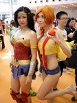  black_hair cosplay fishnets high_heels holding kasumi_(pokemon) lipstick misty nintendo orange_hair photo pokemon sexycyborg short_shorts shorts sideboob tagme wonder_woman 