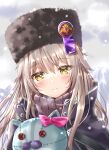  1girl absurdres ayaro_(genkiloobaii) charlotta_skopovskaya commentary_request grey_hair hat heaven_burns_red highres looking_at_viewer snow snowing stuffed_animal stuffed_toy ushanka yellow_eyes 