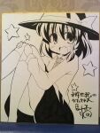  1girl absurdres blush bow collared_shirt commentary_request fang feet_out_of_frame hands_on_own_knees hat hat_bow highres kikkawa_(citrus_fruits) kneehighs looking_at_viewer medium_hair monochrome necktie open_mouth photo_(medium) shikishi shirt skirt smile socks solo star_(symbol) thighs touhou traditional_media translation_request usami_renko 