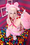  1girl asian breasts chouzuki_maryou cosplay headphones heart large_breasts nitroplus photo pink_hair plump solo super_sonico super_sonico_(cosplay) 