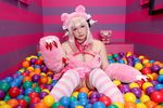  1girl asian breasts chouzuki_maryou cosplay headphones heart large_breasts nitroplus photo pink_hair plump solo super_sonico super_sonico_(cosplay) 