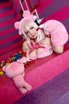  1girl asian breasts chouzuki_maryou cosplay headphones heart large_breasts nitroplus photo pink_hair plump solo super_sonico super_sonico_(cosplay) 