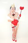  1girl asian breasts chouzuki_maryou cosplay headphones heart large_breasts nitroplus photo pink_hair plump princess_of_hearts solo super_sonico super_sonico_(cosplay) 