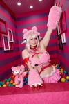  1girl asian breasts chouzuki_maryou cosplay headphones heart large_breasts nitroplus photo pink_hair plump solo super_sonico super_sonico_(cosplay) 