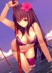  bikini cloud dutch_angle fate/grand_order fate_(series) flower hair_flower hair_ornament hibiscus leaning_forward long_hair machimura_komori polearm red_eyes scathach_(fate)_(all) scathach_(swimsuit_assassin)_(fate) solo swimsuit wading weapon 