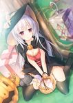  blush breasts candy cape capelet cat cleavage commentary food garter_belt gift halloween hat highres kneeling lantern massan medium_breasts original pumpkin silver_hair smile solo thighhighs tree witch witch_hat 