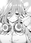  1girl blush breasts cleavage closed_mouth commentary english_commentary go-toubun_no_hanayome greyscale hair_between_eyes headphones headphones_around_neck looking_at_viewer lying medium_hair monochrome mushi024 nakano_miku on_back sidelocks sleeves_past_wrists smile solo upper_body 