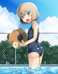  ass ball beachball blonde_hair blue_eyes blue_swimsuit boko_(girls_und_panzer) chain-link_fence fang fence girls_und_panzer highres katyusha looking_at_viewer one-piece_swimsuit open_mouth reflection rorimo school_swimsuit short_hair standing swimsuit tree water wet 