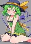  bare_legs bare_shoulders blush breasts bwell cleavage dress green_dress green_eyes green_hair hat hat_ribbon highres komeiji_koishi ribbon short_dress sitting small_breasts solo third_eye touhou wariza 