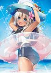  ass blonde_hair blue_eyes crop_top fang flower hair_flower hair_ornament hat hibiscus hirai_yuzuki innertube kantai_collection long_hair looking_at_viewer looking_back one-piece_swimsuit one-piece_tan ro-500_(kantai_collection) sailor_collar school_swimsuit solo sun_hat swimsuit swimsuit_under_clothes tan tanline wading water 