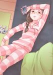  1girl arm_up brown_eyes brown_hair cellphone couch feet_out_of_frame from_above hair_over_shoulder highres hood hood_down indoors long_sleeves looking_up lying nintendo_64_controller on_back on_couch pajamas parted_lips phone pillow smartphone solo sora_yori_mo_tooi_basho striped takahashi_megumi tsukune_(seseri) 