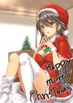  blurry blurry_background blush brown_hair capelet christmas_tree fingers_together fur-trimmed_dress hair_ornament haruna_(kantai_collection) hat holly_hair_ornament kantai_collection kyougoku_touya long_hair merry_christmas neck_ribbon parted_lips ribbon santa_costume santa_hat solo thighhighs white_legwear yellow_eyes 