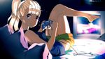  bed blonde_hair breasts controller crossed_legs dark_skin game_console game_controller gamecube gamecube_controller gamepad highres horiguchi_yukiko_(style) long_hair looking_at_viewer medium_breasts original pillow plantar_flexion ponytail purple_eyes shorts smile solo television tom_skender 