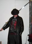  anonymous chair clothing fedora hat human jeans katana mammal melee_weapon not_furry pants real robe shirt simple_background sword we_are_legion weapon white_background 