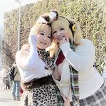 2girls asian blonde_hair bra breasts cleavage cosplay fat female headphones hoshima_mika huge_breasts large_breasts multiple_girls photo scarf super_pochaco super_pochaco_(cosplay) 