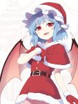  1girl asutora bat_wings belt black_belt blue_hair blush capelet commentary cowboy_shot dress fang gloves hat highres open_mouth pointy_ears pom_pom_(clothes) red_capelet red_eyes red_headwear remilia_scarlet santa_costume santa_dress santa_gloves santa_hat short_hair smile solo touhou wings 