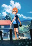  1girl ahoge black_shorts blue_eyes blue_shirt building closed_mouth cloud commentary_request cumulonimbus_cloud day fence grass highres inami_hatoko long_hair looking_at_viewer orange_hair original outdoors paddle shirt short_hair shorts sky solo standing table_tennis_paddle textless_version 