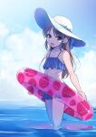  1girl bare_shoulders bikini bikini_skirt blue_bikini blue_sky blush brown_eyes brown_hair collarbone day flat_chest food_print from_side green_ribbon hat hat_ribbon holding holding_swim_ring horizon idolmaster idolmaster_cinderella_girls idolmaster_cinderella_girls_starlight_stage long_hair looking_at_viewer ocean open_mouth outdoors pink_innertube print_innertube ribbon shiroyukimajima sky smile solo strawberry_print swim_ring swimsuit tachibana_arisu wading 