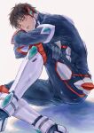  1boy ao_isami arms_on_knees black_hair bruise bruise_on_face bulge grey_background head_on_hand highres injury male_focus omochinosu parted_lips pilot_suit short_hair simple_background skin_tight solo yuuki_bakuhatsu_bang_bravern 