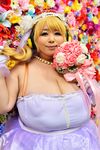  1girl asian blonde_hair breasts brown_eyes cleavage cosplay fat headphones hoshima_mika huge_breasts nitroplus photo solo super_pochaco super_pochaco_(cosplay) 