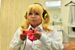  1girl asian blonde_hair bra breasts cleavage cosplay fat female headphones hoshima_mika huge_breasts large_breasts photo solo super_pochaco super_pochaco_(cosplay) 