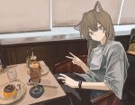  1girl absurdres animal_ears black_pants brown_hair cafe cat_ears chair cup double-parted_bangs drinking_glass food grey_eyes hair_between_eyes highres indoors looking_at_viewer original pants plate pudding restaurant scenery shirt sitting spoon t-shirt table v watch white_shirt wristwatch zumochi 