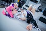  1girl copyright_request cosplay dress headdress lana_rain maid photo pink_eyes pink_hair ram_(re:zero) short_hair thighhighs 