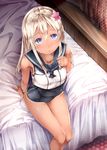  bed blonde_hair blush breasts commentary commentary_request flower hair_flower hair_ornament highres kantai_collection long_hair medium_breasts purple_eyes ro-500_(kantai_collection) school_swimsuit skin_tight solo sugiyuu swimsuit 