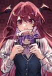  1girl :d black_vest blush character_doll chinese_commentary commentary doll hair_between_eyes head_wings highres holding holding_doll juliet_sleeves koakuma long_hair long_sleeves looking_at_viewer open_mouth patchouli_knowledge puffy_sleeves red_background red_eyes red_hair sample_watermark smile solo teeth ting_shi_16 touhou upper_body upper_teeth_only vest watermark wings 