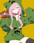  1girl absurdres alternate_hair_color animal_ears cat_ears chinese_commentary choker commentary_request creeparka creeper cupa_(at2.) explosive fake_animal_ears green_eyes green_hoodie highres hood hood_up hoodie kongbushu long_hair long_sidelocks long_sleeves looking_at_viewer minecraft mob_talker personification pink_hair sidelocks simple_background sitting solo tnt tnt_block_(minecraft) tongue tongue_out very_long_sidelocks yellow_background 
