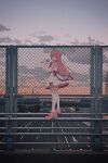  1girl :d black_eyes bridge chain-link_fence cloud cloudy_sky dress evening fence frilled_dress frills from_side hand_up highres highway holding holding_microphone long_hair looking_at_viewer microphone nijisanji nkymyura open_mouth outdoors pink_footwear pink_hair railing shoes short_dress short_sleeves sidelocks sky smile solo suo_sango thighhighs tiara virtual_youtuber walking_on_railing white_dress white_thighhighs wide_shot zettai_ryouiki 