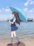  1girl absurdres blue_shirt blue_skirt blue_umbrella blue_vest brown_shoes commentary full_body grey_socks highres holding holding_umbrella kneehighs loafers love_live! love_live!_nijigasaki_high_school_idol_club miniskirt neck_ribbon nijigasaki_school_uniform osaka_shizuku outdoors photo_background plaid_clothes plaid_skirt pleated_skirt ribbon school_uniform shinonome_sakura shirt shoes short_sleeves skirt socks solo summer_uniform umbrella vest walking yellow_ribbon 
