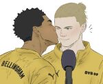  2boys black_hair blonde_hair blush borussia_dortmund closed_eyes commentary dark-skinned_male dark_skin erling_haaland ghosttangels hair_bun hair_over_one_eye jude_bellingham kiss kissing_cheek male_focus microphone multiple_boys notice_lines puma_(brand) real_life short_hair simple_background smile white_background yaoi 