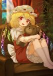  1girl :d absurdres ascot back_bow blonde_hair bloomers bow collared_shirt commentary_request couch crystal crystal_wings day ekaapetto english_commentary flandre_scarlet frilled_shirt_collar frilled_skirt frills hat hat_bow highres hugging_doll hugging_object indoors looking_at_viewer making-of_available mixed-language_commentary mob_cap multicolored_wings on_couch one_side_up open_mouth paid_reward_available plant red_bow red_eyes red_skirt red_vest shirt sitting skirt skirt_set smile socks solo stuffed_animal stuffed_toy teddy_bear touhou vest white_bloomers white_bow white_hat white_shirt white_socks window wings yellow_ascot 