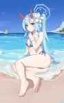  1girl absurdres ass bare_arms bare_legs bare_shoulders barefoot beach bikini blue_archive blue_bikini blue_hair blue_halo blush breasts chise_(blue_archive) chise_(swimsuit)_(blue_archive) collarbone day flower hair_flower hair_ornament halo happy05x highres horns long_hair looking_at_viewer navel ocean official_alternate_costume outdoors parted_lips ponytail red_eyes red_horns sitting small_breasts solo striped_bikini striped_clothes swimsuit toes white_flower 