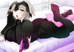  ass bed blonde_hair blush breasts chocolate commentary_request fate/grand_order fate_(series) feet hair_ornament jeanne_d'arc_(alter)_(fate) jeanne_d'arc_(fate)_(all) large_breasts looking_at_viewer lying on_stomach open_mouth pillow short_hair thighhighs valentine vane yellow_eyes 
