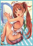  ass baffu ball bare_legs beach beachball bikini blue_border blush border breasts brown_eyes brown_hair dimples_of_venus from_above from_behind highres kantai_collection libeccio_(kantai_collection) long_hair looking_at_viewer looking_back open_mouth sandals shirt sitting sleeveless sleeveless_shirt small_breasts solo striped striped_bikini swimsuit tan tied_shirt twintails 