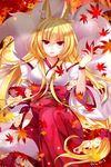  2015 :d animal_ears autumn_leaves bad_id bad_pixiv_id bangs bare_shoulders blonde_hair blurry bow breasts dated depth_of_field detached_sleeves eyebrows_visible_through_hair falling_leaves felicia-val flower fox fox_ears fox_tail hair_between_eyes hakama hakama_skirt hip_vent holding japanese_clothes kimono knee_up leaf light_particles long_hair long_sleeves looking_at_viewer low-tied_long_hair medium_breasts multiple_tails open_mouth original red_bow red_eyes red_hakama signature sitting sleeveless sleeveless_kimono smile solo tail underbust very_long_hair white_kimono wide_sleeves wristband 