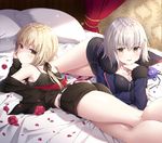  artoria_pendragon_(all) ass bed bed_sheet black_jacket black_shirt black_shorts blonde_hair blue_jacket breasts camisole canopy_bed cleavage cushion elbow_rest fate/grand_order fate_(series) from_behind hair_between_eyes indoors jacket jeanne_d'arc_(alter)_(fate) jeanne_d'arc_(fate)_(all) kneepits large_breasts looking_at_viewer lying masuishi_kinoto multiple_girls on_stomach parted_lips petals saber_alter shirt shorts silver_hair sleeveless sleeveless_shirt smile thighs wicked_dragon_witch_ver._shinjuku_1999 yellow_eyes 