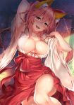  1girl animal_ears arm_up armpits blush breasts cleavage fate/extra fate_(series) fox_ears hakama_skirt highres japanese_clothes kawai large_breasts leg_up licking_lips lying miko no_bra on_back pink_hair tamamo_(fate)_(all) tamamo_no_mae_(fate) tongue tongue_out yellow_eyes 