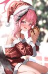  1girl absurdres blue_archive blush christmas feathered_wings gift gisi_(gicgic_draw) halo hat highres holding holding_gift koharu_(blue_archive) long_hair looking_at_viewer low_twintails open_mouth pink_eyes pink_hair pom_pom_(clothes) red_halo red_headwear santa_costume santa_hat solo twintails wings 