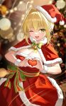  1girl ahoge blonde_hair blurry blurry_background capelet chinese_commentary christmas_tree commentary_request cowboy_shot dress fate/extra fate_(series) fur-trimmed_capelet fur-trimmed_dress fur_trim green_eyes hair_intakes hat heart heart_hands highres looking_at_viewer nero_claudius_(fate) one_eye_closed open_mouth red_capelet red_dress santa_dress santa_hat shenqi_xiao_hong_zai_nali solo wristband 