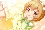  1girl blush bow bow_hairband brown_eyes brown_hair commentary dress floral_background frilled_dress frilled_sleeves frills fuu_(koneko_no_yomeiri) gradient_background green_bow green_dress hairband hands_on_own_chin idolmaster idolmaster_cinderella_girls koga_koharu legs_up lens_flare lying open_mouth pink_background short_hair smile solo white_hairband yellow_background 