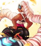  1girl arms_(game) ass bare_shoulders blonde_hair breasts commentary dark_skin earrings green_eyes high_heel_sneakers high_heels highres jewelry kimmi leg_lift lips long_hair mask nail_polish pants solo thick_thighs thighs twintelle_(arms) very_long_hair 