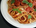  commentary derivative_work fettuccine food masakari no_humans pasta plate sauce tomato 